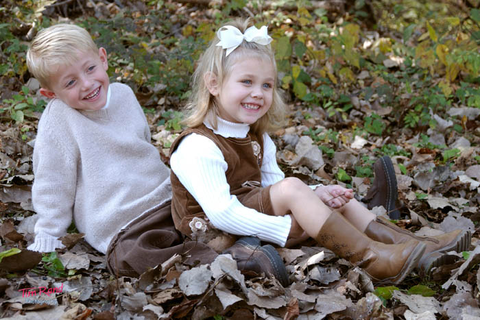brother and sister in leaves